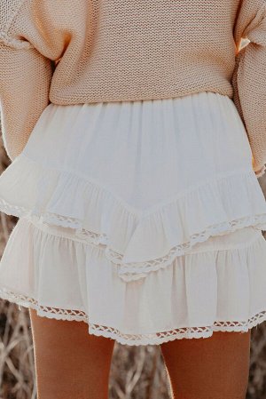 Белая однотонная многоярусная мини-юбка с оборками и завышенной талией