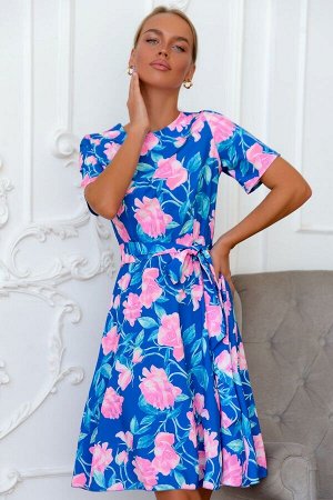 Платье Трендовое платье с принтом в крупный цветок можно носить круглый год. Изысканно, свежо и необычно выглядит сочетание глубокого синего с тонкими веточками и крупными бутонами розовых цветов. Кор