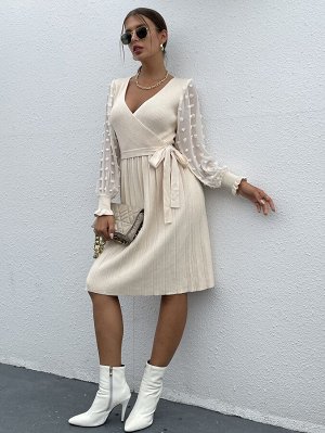 Трикотажное платье-свитер с помпонами
