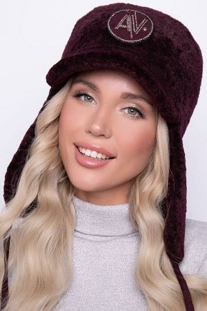 Ушанка Стильная и роскошная женская зимняя шапка- ушанка. Выверенные пропорции верхней части шапки и изящные удлинённые ушки делают эту модель не только выразительной, но и очень тёплой, надёжно защищ