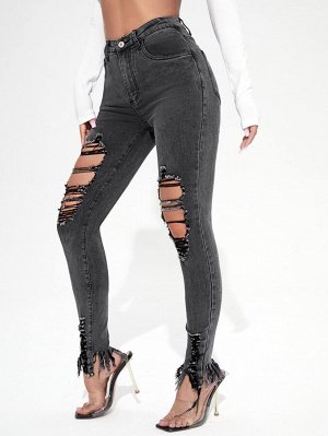 Рваные джинсы с необработанным низом и бахромой