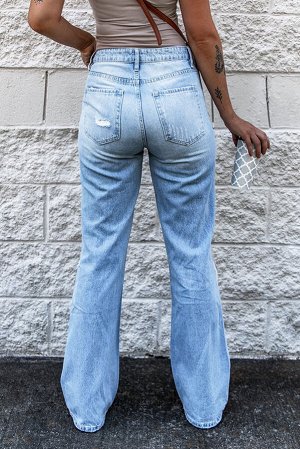 Голубые потертые джинсы-клеш с высокой талией и дырками на коленях