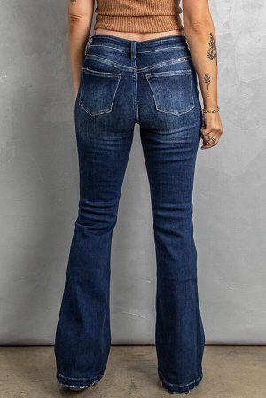 Темно-синие джинсы-клеш с высокой талией и дырками на коленях