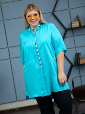 Блузка Модная блуза-рубашка прямого силуэта с воротником- стойкой. Модель выполнена из яркой ткани с высоким содержанием хлопка. Сатиновое переплетение нитей в полотне, придает материалу бархатистость