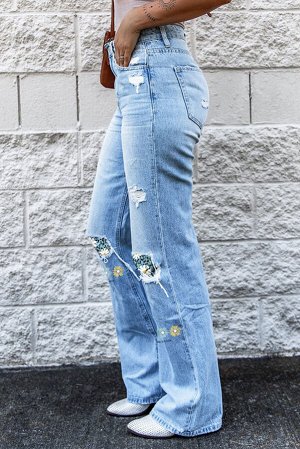 Голубые джинсы-клеш с заплатками с разноцветным цветочным принтом в стиле пэчворк