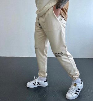Мужские спортивные штаны 6506 "Надписи Коленки" Светло-Бежевые