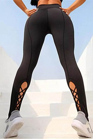 Черные леггинсы для фитнеса и йоги с перекрестными разрезами на штанинах