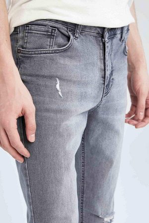 Джинсовые брюки скинни Super Skinny с нормальной талией и рваными деталями