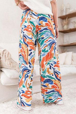 Разноцветные широкие штаны с высокой талией и красочным принтом