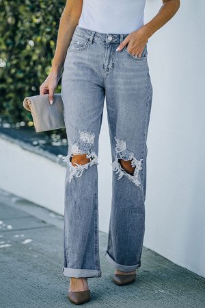 Голубые широкие джинсы с высокой талией дырками на коленях