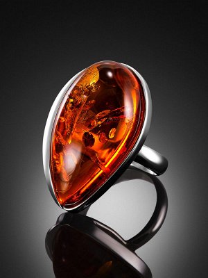 amberholl Нарядное серебряное кольцо с цельным натуральным янтарем коньячного цвета с искорками «Лагуна»