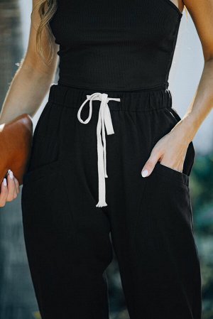 Черные однотонные брюки с карманами и завязками