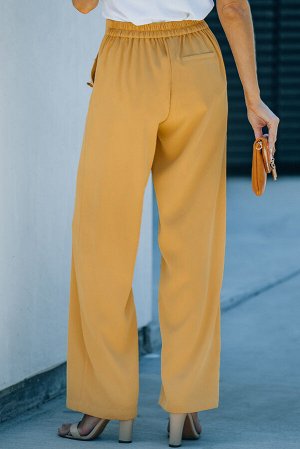 Желтые укороченные брюки прямого кроя