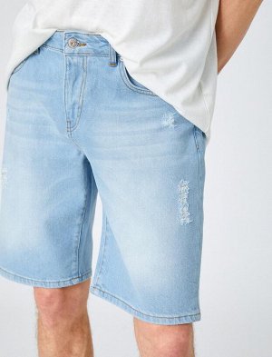 Потертые джинсовые шорты