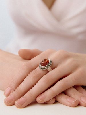 Крупное эффектное кольцо из серебра с марказитами и янтарём «Эйфория»