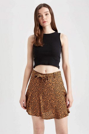 Короткая мини-юбка с леопардовым принтом и оборками