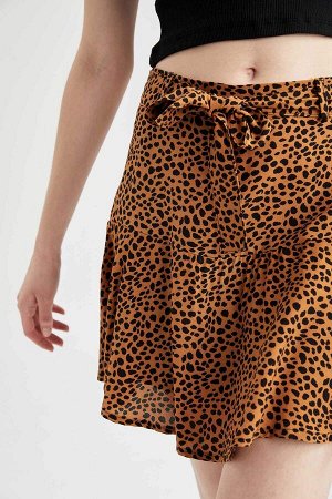 Короткая мини-юбка с леопардовым принтом и оборками