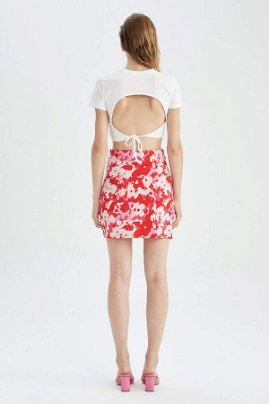 Приталенная мини-юбка с цветочным принтом