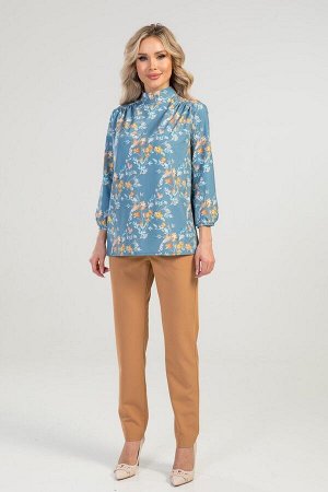 Блуза Блуза выполнена из эластичной блузочной ткани. Расцветка цветы на бирюзовом. Воротник стойка. Рукава длинные 48 см на манжетах. Низ прямой. По спине бант. Без подклада. ДИ  в 42-44 р  68 см, в 4
