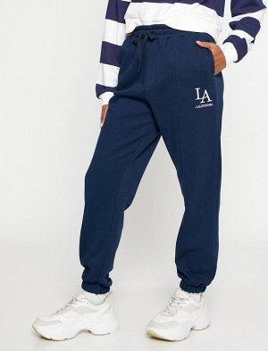 Спортивные штаны Jogger с карманами и завязками на талии