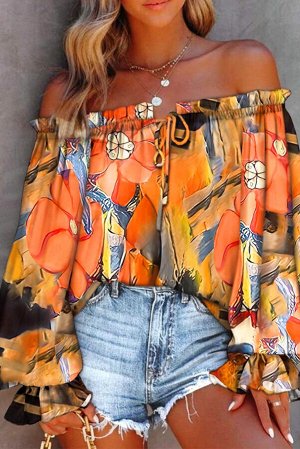 Оранжевая объемная блуза с цветочным принтом и открытыми плечами