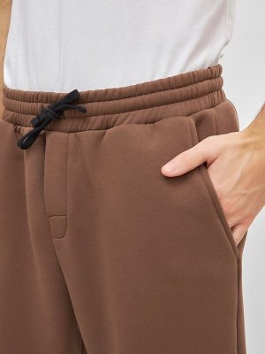 Теплые однотонные брюки в кофейном цвете