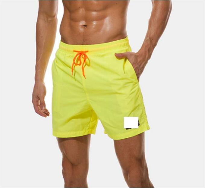 Neon yellow swim trunks